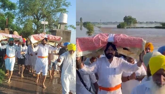ਗੁਦਾਈਕੇ ਦੇ ਗੁਰਦੁਆਰਾ ਸਾਹਿਬ 'ਚ ਪਾਣੀ ਵੜਨ 'ਤੇ ਲਾਲਜੀਤ ਸਿੰਘ ਭੁੱਲਰ ਨੇ ਸ੍ਰੀ ਗੁਰੂ ਗ੍ਰੰਥ ਸਾਹਿਬ ਦੇ ਸਰੂਪ ਸਿਰ 'ਤੇ ਚੁੱਕ ਕੇ ਸੁਰੱਖਿਅਤ ਥਾਂ' ਤੇ ਪਹੁੰਚਾਏ Cabinet Minister Laljit Singh Bhullar himself arrived by boat to bring out the families trapped in the river safely ਗੁਦਾਈਕੇ ਦੇ ਗੁਰਦੁਆਰਾ ਸਾਹਿਬ 'ਚ ਪਾਣੀ ਵੜਨ 'ਤੇ ਲਾਲਜੀਤ ਸਿੰਘ ਭੁੱਲਰ ਨੇ ਸ੍ਰੀ ਗੁਰੂ ਗ੍ਰੰਥ ਸਾਹਿਬ ਦੇ ਸਰੂਪ ਸਿਰ 'ਤੇ ਚੁੱਕ ਕੇ ਸੁਰੱਖਿਅਤ ਥਾਂ' ਤੇ ਪਹੁੰਚਾਏ