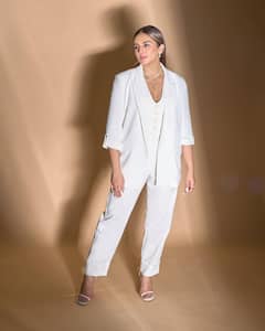Huma Qureshi Oozes Elegance In A Classic White Pantsuit For 'Tarla' Promotions