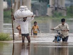 In Pics: Thousands Evacuated As Yamuna Crosses Danger Mark In Delhi