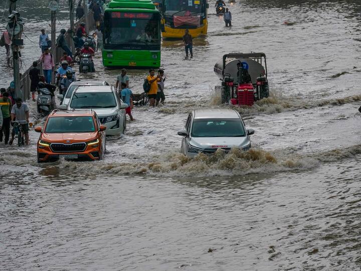 Harried commuters struggled to reach their offices as Yamuna floodwaters submerged the busy ITO intersection and Rajghat in central Delhi on Friday.