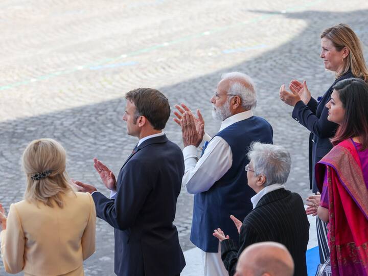 Prime Minister Narendra Modi with French President Emmanuel Macron, First Lady Brigitte Macron and others during Bastille Day Parade in Paris. Image Source: PTI