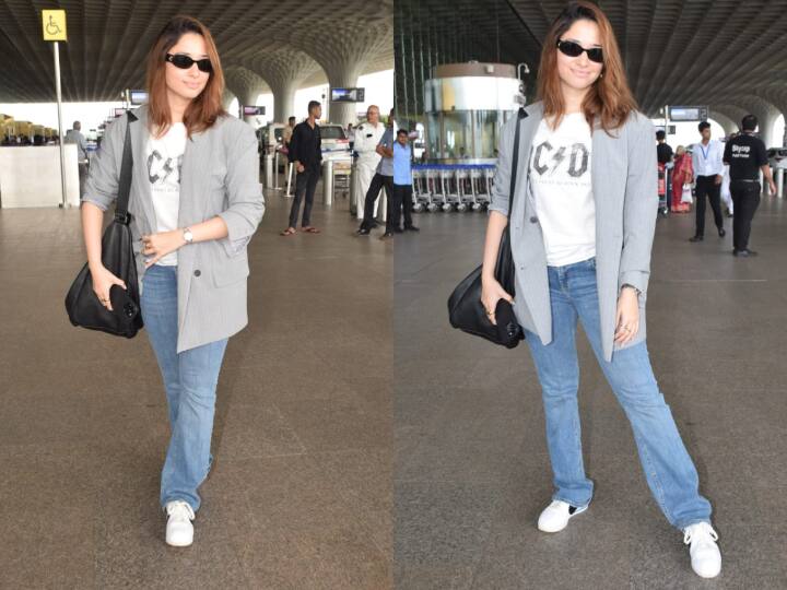 Tamannah Bhatia Airport Look: तमन्ना भाटिया को रविवार सुबह एयरपोर्ट पर स्पॉट किया गया. जहां वो नो-मेकअप लुक में भी काफी खूबसूरत लग रही थीं. इस दौरान एक्ट्रेस ने पैपराजी को भी जमकर पोज दिए.