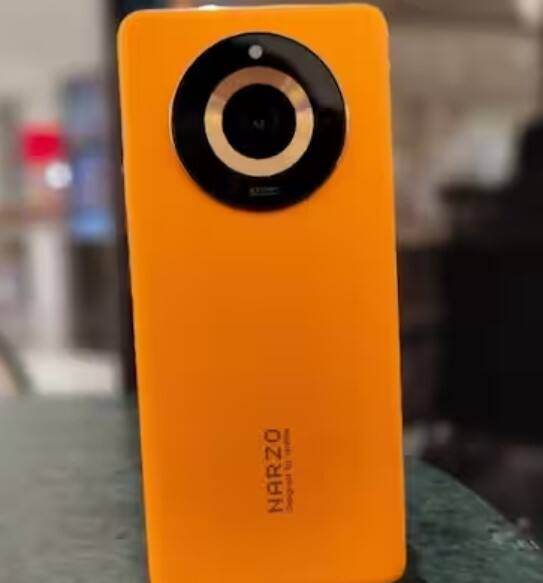 ਤੁਸੀਂ ਹਾਲ ਹੀ ਵਿੱਚ ਲਾਂਚ ਕੀਤੇ Realme Narzo 60 ਸਮਾਰਟਫੋਨ ਨੂੰ Amazon ਤੋਂ 1,000 ਰੁਪਏ ਵਿੱਚ ਸਸਤੇ ਵਿੱਚ ਖਰੀਦ ਸਕਦੇ ਹੋ। ਵੈਸੇ ਇਸ ਫੋਨ ਦੀ ਕੀਮਤ 17,999 ਰੁਪਏ ਹੈ। ਫੋਨ 'ਚ 64MP ਪ੍ਰਾਇਮਰੀ ਕੈਮਰਾ, ਮੀਡੀਆਟੇਕ ਡਾਇਮੈਂਸਿਟੀ 6020 ਪ੍ਰੋਸੈਸਰ ਅਤੇ 5000 mAh ਬੈਟਰੀ ਹੈ।