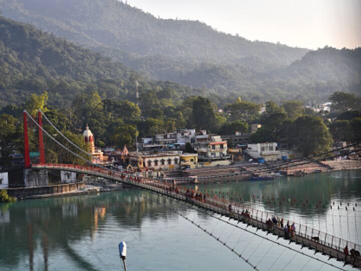 Rishikesh: Visit Rishikesh to find peace in the lap of the Himalayas. The place provides a tranquil setting for spiritual seekers. Visit the famed Lakshman Jhula and Ram Jhula, and participate in adventure activities such as river rafting and trekking. (Image Source: Getty)