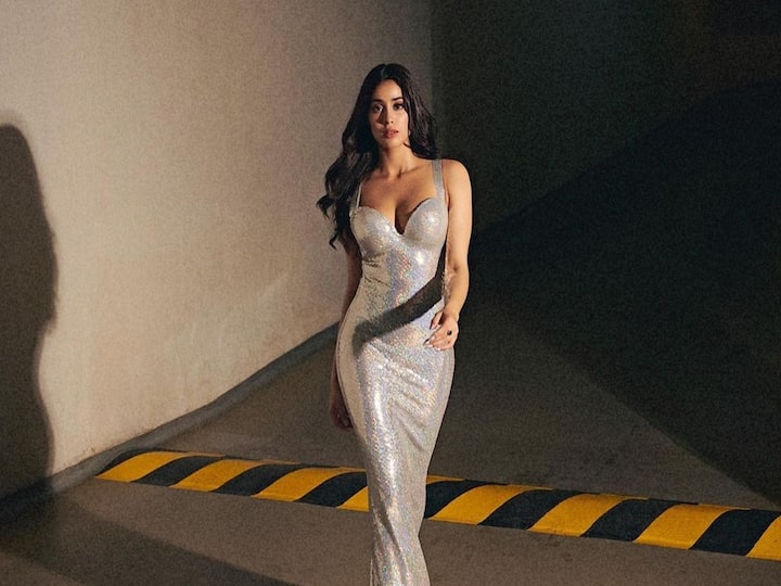 To promote her new movie 'Bawaal', Janhvi Kapoor dressed in a shimmering holographic gown.