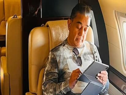 Project K actor Kamal Haasan shows ‘write way to fly’ Project K : ப்ராஜெக்ட் கே’வுக்காக சான் டியாகோ செல்லும் கமல் - வைரலாகும் புகைப்படம்