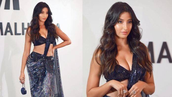 Nora Fatehi Pics: ਅਦਾਕਾਰਾ ਨੋਰਾ ਫਤੇਹੀ ਨੇ ਬਲੈਕ ਕਲਰ ਦੇ ਸ਼ੀਮਰੀ ਆਊਟਫਿਟ 'ਚ ਸੋਸ਼ਲ ਮੀਡੀਆ 'ਤੇ ਕਾਫੀ ਗਲੈਮਰਸ ਤਸਵੀਰਾਂ ਸ਼ੇਅਰ ਕੀਤੀਆਂ ਹਨ। ਉਸ ਦੀਆਂ ਤਸਵੀਰਾਂ ਪ੍ਰਸ਼ੰਸਕਾਂ ਦੇ ਦਿਲਾਂ ਨੂੰ ਬੇਚੈਨ ਕਰ ਰਹੀਆਂ ਹਨ।