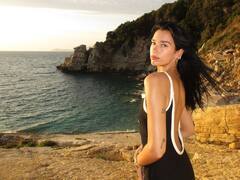 Dua Lipa Shares Pics In Black Swimwear Amid Scenic Backdrop