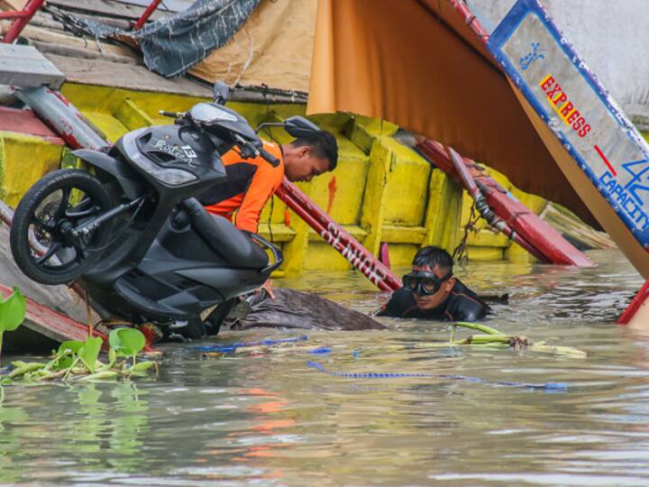 Before lashing China, Doksuri hit the Philippines. At least 26 people died after a boat capsised on Thursday just yards from reaching Talim Island. Here rescue workers are seen around the site where the ferry capsied. (Source: Getty)