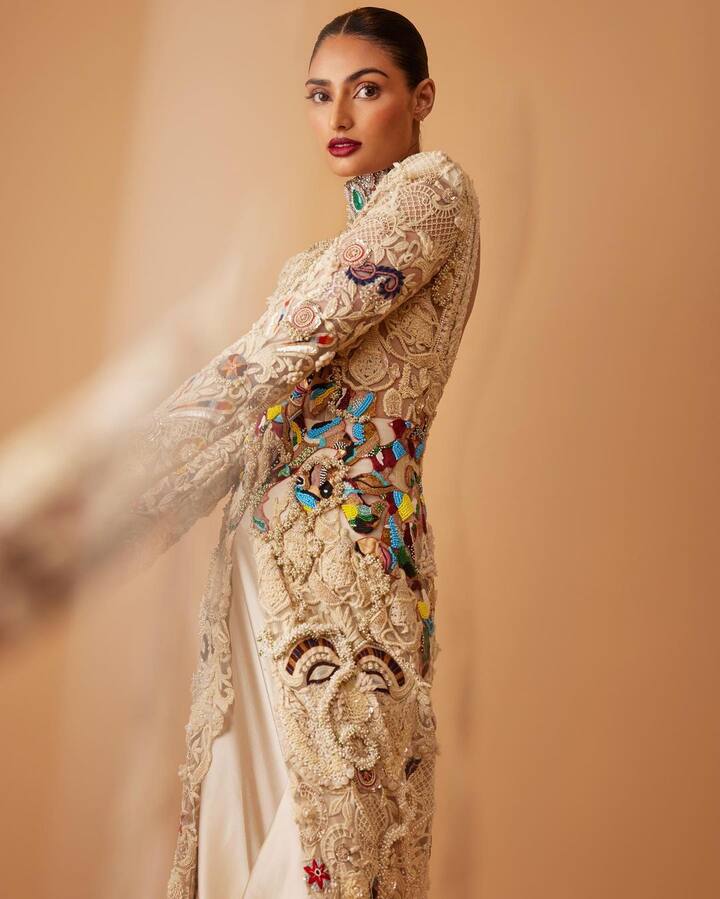 Athiya looked stunning in a full-sleeved pastel lace kurta with elegant embroidery and threadwork.