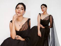 బ్లాక్ శారీలో కైపెక్కించే చూపులతో కుర్రాళ్ళ మతిపోగొడుతున్న అందాల ‘అమ్ము’