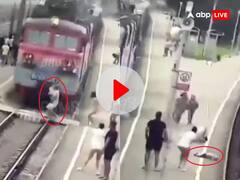 ट्रैक पार कर रहे बाप-बेटे को ट्रेन ने मारी टक्कर, हवा में उड़ते हुए गिरे प्लेटफार्म पर, देखिए फिर क्या हुआ...