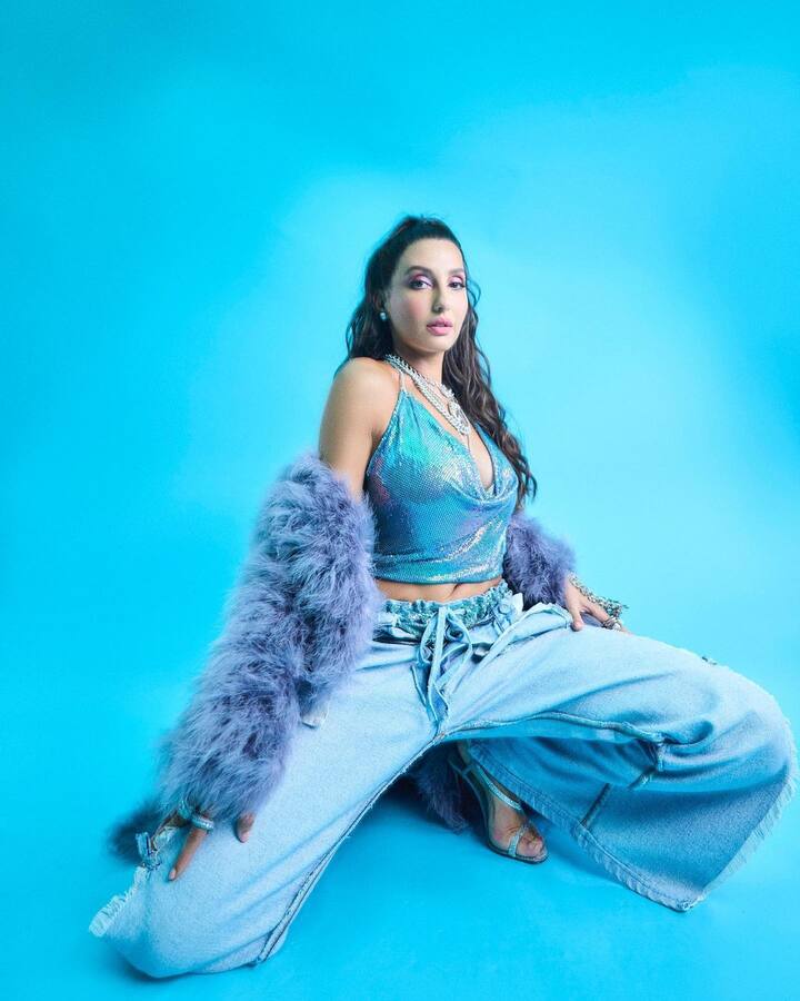 Nora donned a blue shimmery halter top with a plunging neckline. She picked this ensemble from Nikita Karizma label.