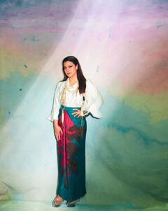 Kajol Poses In A White Shirt Paired With A Red And Blue Wrap Around Skirt