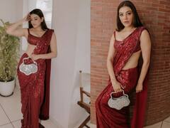 Kajal Aggarwal Oozes Oomph In Shimmery Red Saree