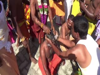 திண்டுக்கல் மாவட்ட  கோயில் ஆடித் திருவிழா; பக்தர்கள் தலையில் தேங்காய் உடைத்து வழிபாடு