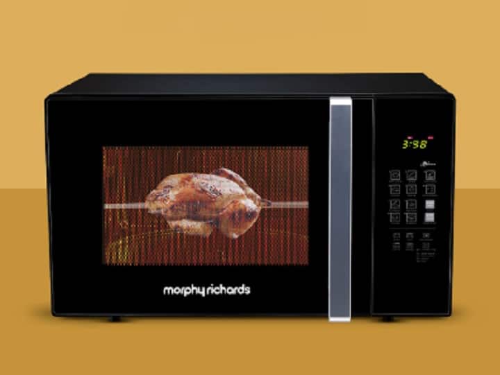 Morphy Richards 30 MCGR Deluxe: मॉर्फी रिचर्ड्स ब्रांड में आप यह 30 लीटर वाला माइक्रोवेव ओवन अमेजन पर 49 प्रतिशत के डिस्काउंट पर खरीद सकते हैं. इसकी कीमत सेल में सिर्फ 9,990 रुपये है. इसमें चाइल्ड लॉक फीचर भी मिलेगा. इसमें मल्टी स्टेज कुकिंग ऑप्शन है.
