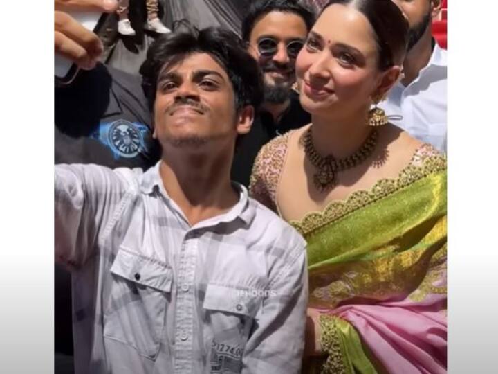 Tamannaah Bhatia Shakes Hands, Poses For Selfie With An Excited Fan Who Jumps Security To Meet Her In Kerala Tamannaah Bhatia Shakes Hands, Poses For Selfie With An Excited Fan Who Jumps Security To Meet Her In Kerala