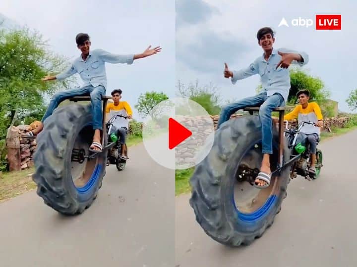 Desi jugaad putting tractor wheel in front of bike video viral on social media राजाओं जैसी सवारी करने के लिए लगाया देसी जुगाड़, बाइक के आगे ट्रैक्टर का चक्का लगाकर पूरा गांव घूमा शख्स