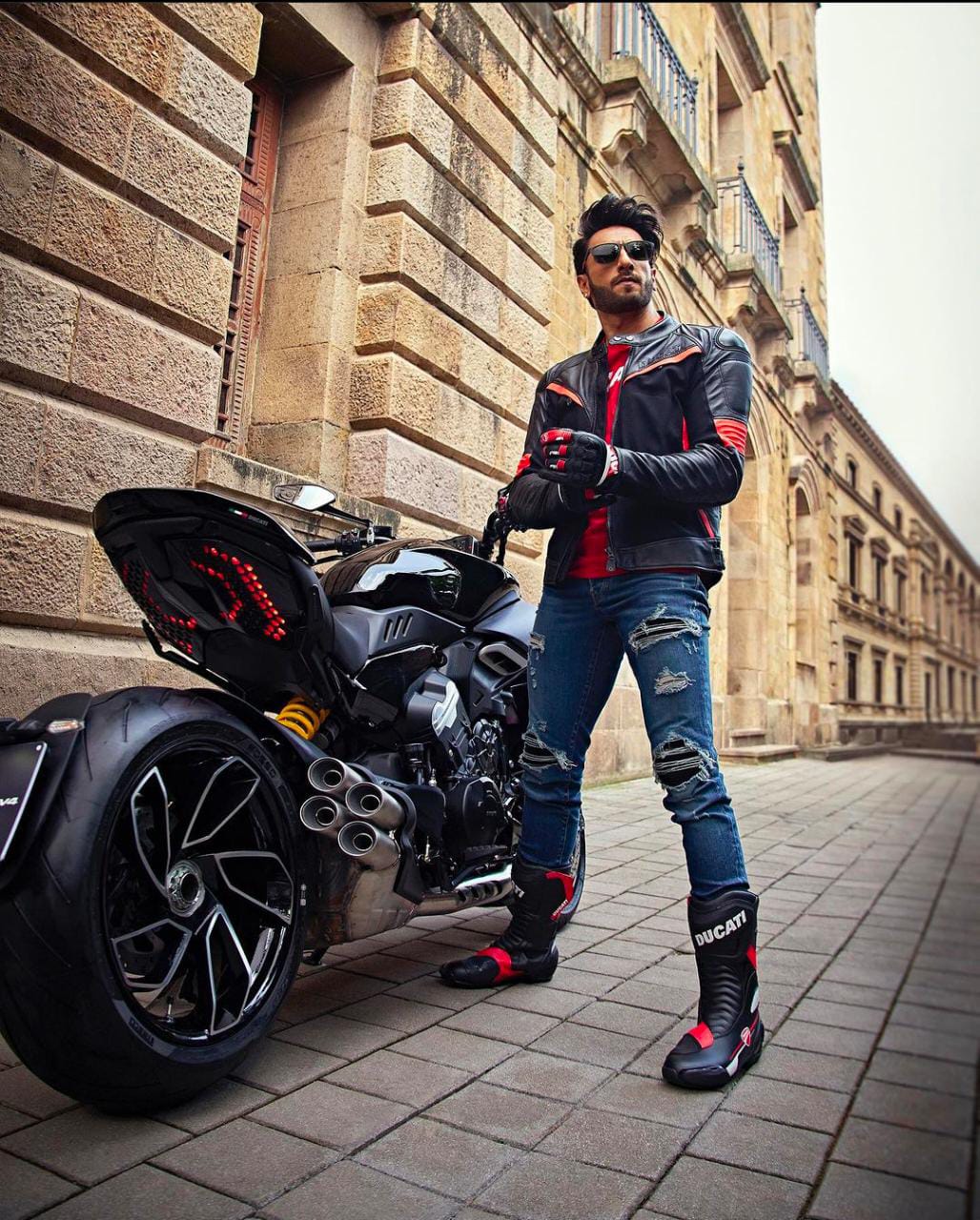 Ranveer Singh in drop dead biker mode for Carrera packs an edgy punch! View  Pictures