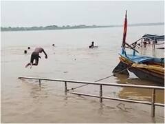 गंगा नदी का जलस्तर बढ़ने के बावजूद छलांग लगा रहे स्टंटबाज, प्रशासन ने बढ़ाई निगरानी
