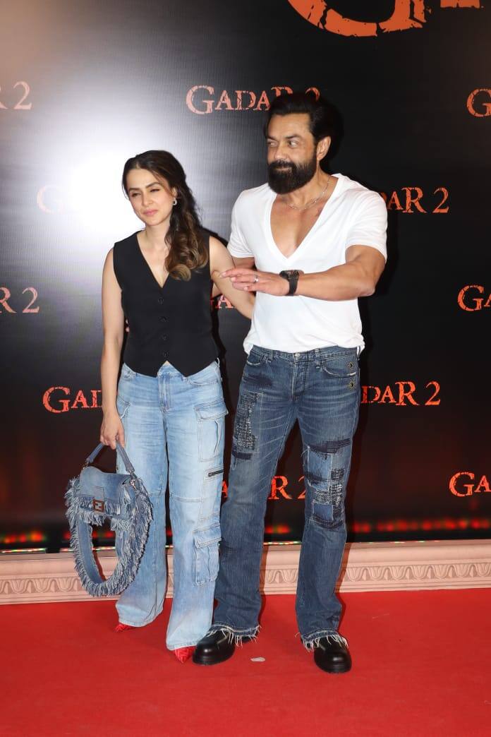 Bobby Deol poses with his wife Tanya as the couple arrives for the screening.