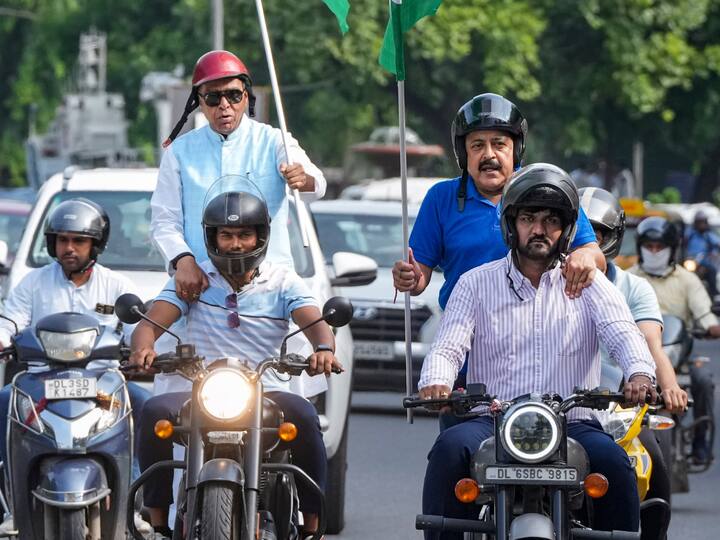 Union Minister of State Jitendra Singh and BJP MP Jagdambika Pal with other participants during the Har Ghar Tiranga Bike Rally in New Delhi. (Photo: PTI)