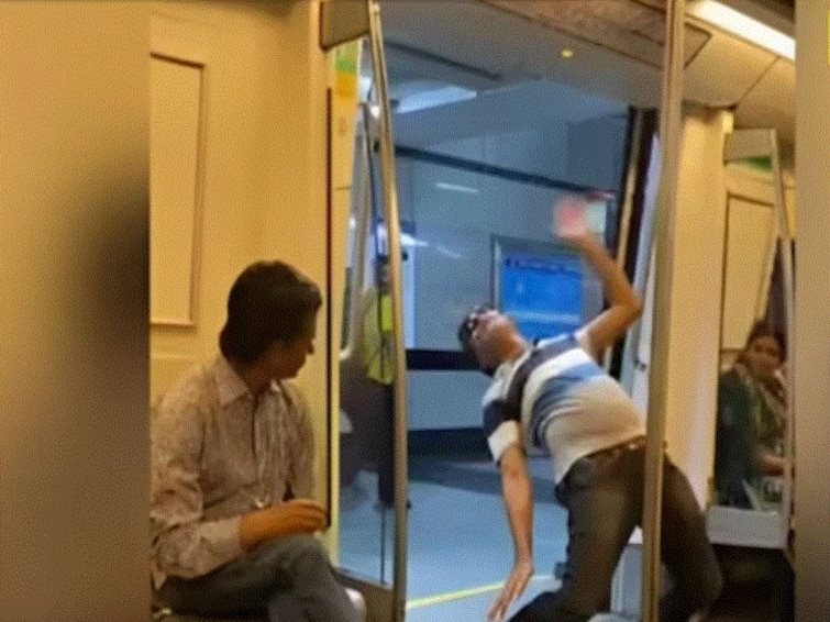 Mans Weird Matrix Like Stunts Inside Delhi Metro Coach Leaves People Stunned Watch Viral Video Man's Weird Matrix-Like Stunts Inside Delhi Metro Coach Leaves People Stunned, Watch Viral Video