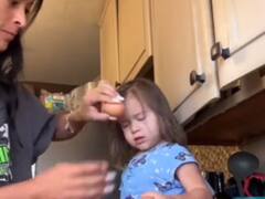 अपने बच्चों के सिर पर अंडे फोड़ रहीं माएं, अनोखा टिक-टॉक चैलेंज हुआ वायरल