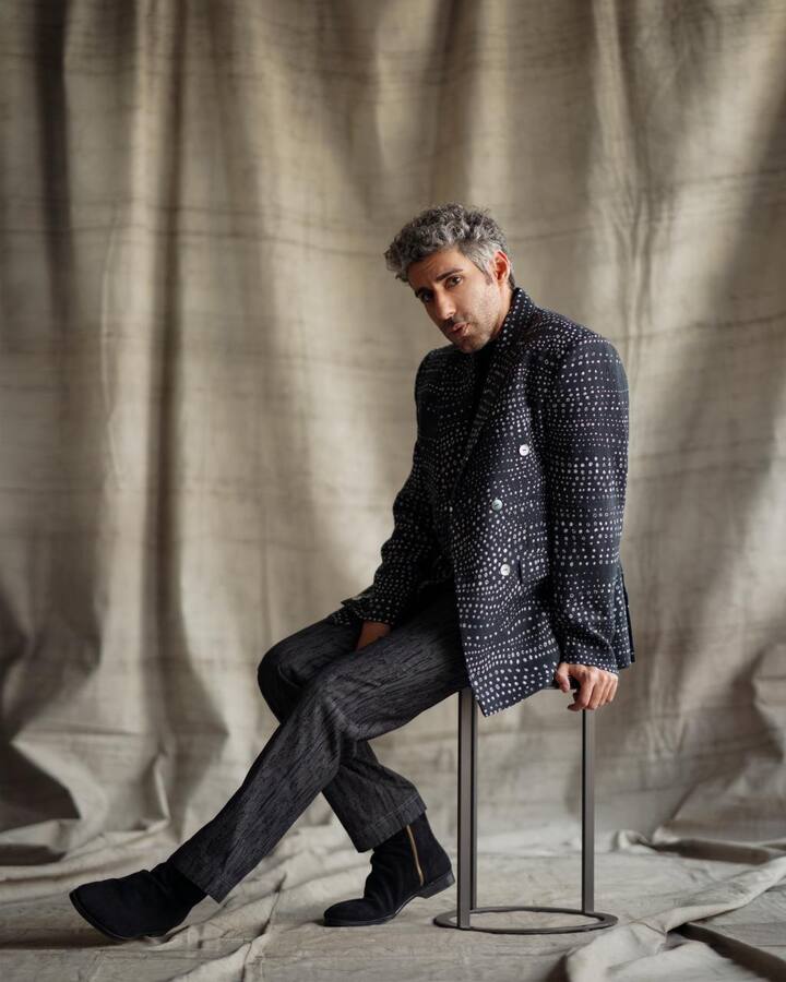 This choice of the versized double-breasted blazer combines classic tailoring with a modern twist. The blazer's impeccable fit and structured silhouette make a bold yet elegant statement.