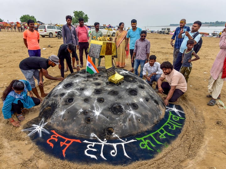Students of Allahabad Central University made a sand sculpture at Sangam in Prayagraj. The lander (Vikram), which carries a rover (Pragyan) in its belly, is expected to touch down near the south polar region around 6.04 pm (Image Source: PTI)
