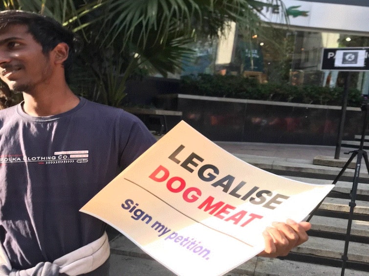 Bengaluru Man's Picture With 'Legalise Dog Meat' Placard Goes Viral Receives Mixed Reactions Bengaluru Man's Picture With 'Legalise Dog Meat' Placard Goes Viral, Receives Mixed Reactions