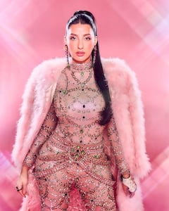 Nora Fatehi Shines In An Embellished Catsuit And Pink Fur Coat; See Pics