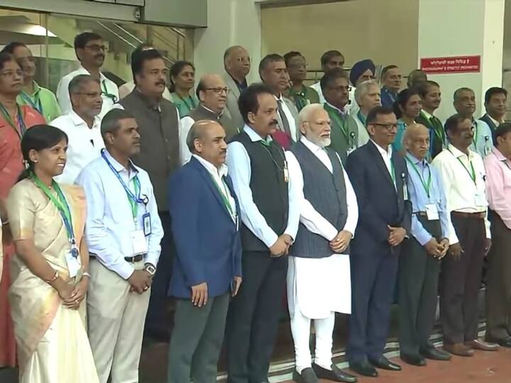 Prime Minister Narendra Modi takes a photo with ISRO scientists at the headquarters soon after his arrival at the agency. (Source: PTI)