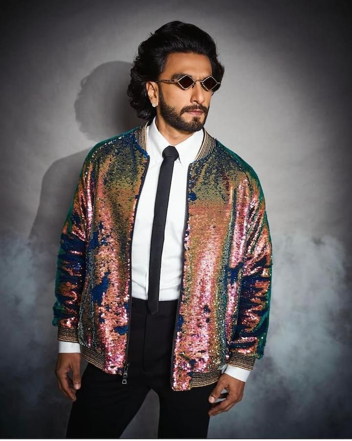 Classy disco vibes: Donning a shiny glittery jacket on a classy white shirt and black pants, Ranveer exudes his perfect party vibes. The add-on is the perfectly donned diamond-shaped goggles. (All Image: @ranveersingh/instagram.)