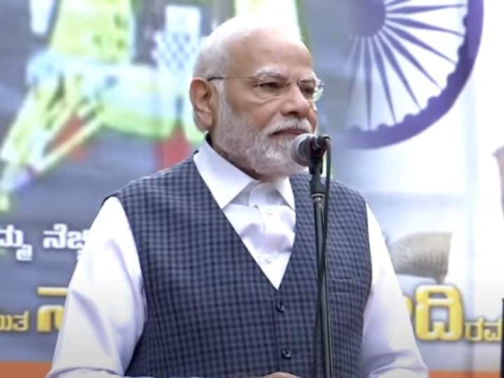 Before heading to ISRO, the Prime Minister addresses people who gathered at the HAL airport. (Source: PTI)