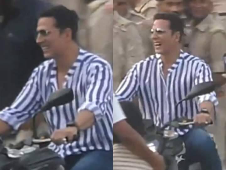 Akshay Kumar met fans in Sitamarhi folded sleeves fukra style riding bike video viral धारीदार शर्ट, फोल्डेड स्लीव्स, 'फुकरा' अंदाज में फैंस से मिले अक्षय कुमार! बाइक चलाते हुए वायरल हुआ एक्टर का वीडियो