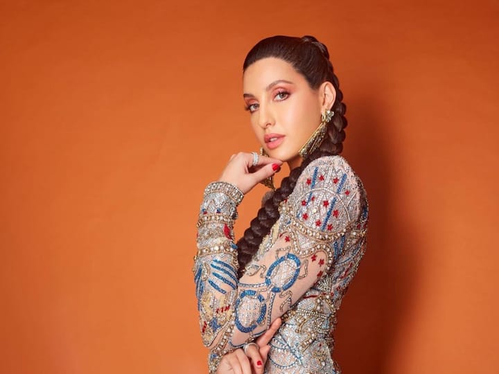 In recent Instagram photos, Nora Fatehi shows her gorgeous side while donning an exquisite multicolored embellished tiny dress.