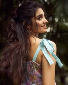 Krithi Shetty Poses In A Blue Floral Dress