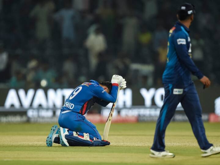 Rashid Khan Sinks To Knees As Afghanistan Crash Out Of Asia Cup Unaware Of NRR Scenario here know latest sports news Watch: अफगानिस्तान के बाहर होते ही टूटा राशिद खान का दिल, रोने वाली तस्वीर हुई वायरल