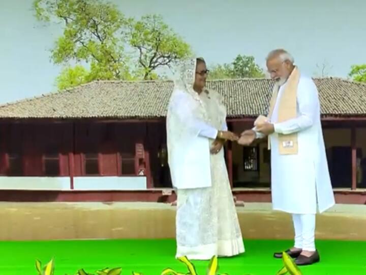 PM Modi greeted Bangladesh Prime Minister Sheikh Hasina as she arrived at Rajghat to pay tributes to Mahatma Gandhi on Sunday. (Image Source: Twitter/@ANI)