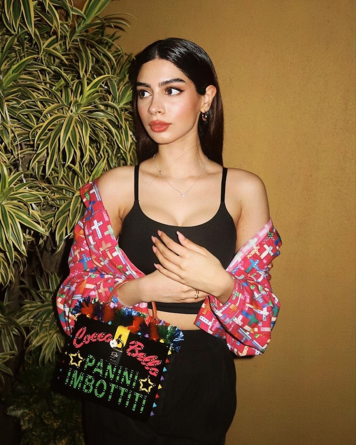 In this recent image, Khushi effortlessly aces the style game, donning a chic jacket paired with a quirky bag that adds a touch of whimsy to her ensemble.