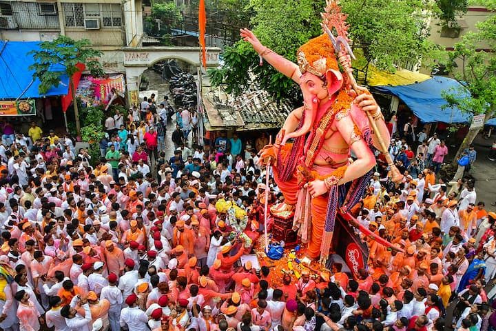 People gather during Ganpati Visarjan celebration at Mumbai. (Image Source: PTI)