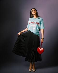 Sonam Kapoor Vibrantly Dresses Up In A Blue Tees And Black Skirt