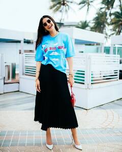 Sonam Kapoor Vibrantly Dresses Up In A Blue Tees And Black Skirt