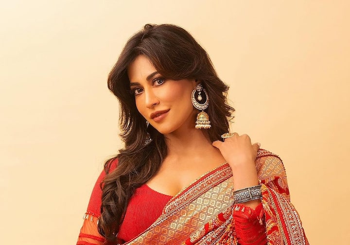 Chitrangda dressed stylishly in a stunning crimson ensemble, giving followers inspiration for the festive season.