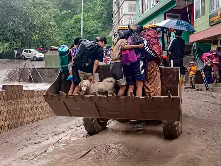 People being rescued from a flooded area in north Sikkim on Wednesday. (Source: PTI)