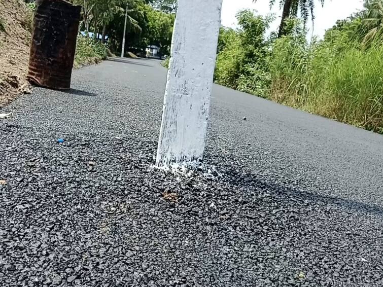 Mayiladuthurai road near without replacing the electric pole மயிலாடுதுறையில் மின்கம்பத்தை அகற்றாமலே புதிய தார்சாலை அமைப்பு - தொடரும் அதிகாரிகள் அலட்சியம்
