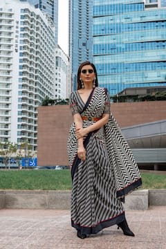 Karishma Tanna Oozes Elegance In A Black And White Saree On The Streets Of Busan