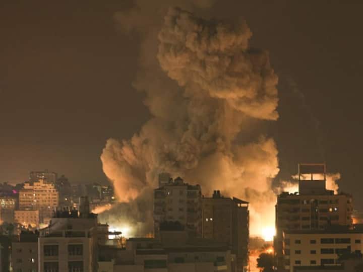 Fire and smoke rise above buildings in Gaza City during an Israeli air strike. (Photo: Getty)